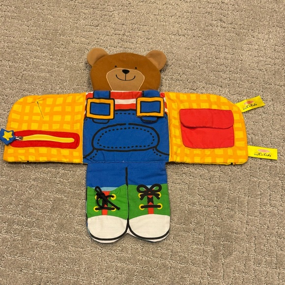Melissa & Doug Soft Activity Baby Book - Dress Up Bear - Picture 3 of 3
